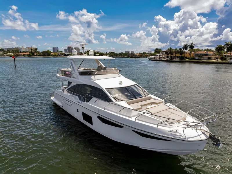 Slide: The Image of Luxury 2022 Azimut Fly 60 yacht cruising on a sunny day. - 6