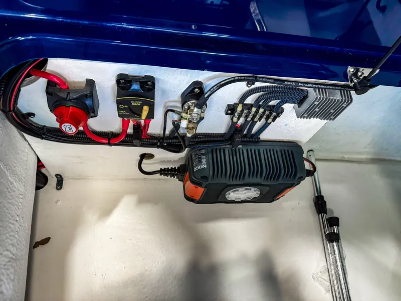 Slide: The Image of Electrical components inside Vision Marine Technologies Volt 180, 2025 model, showcasing wiring and connections. - 14