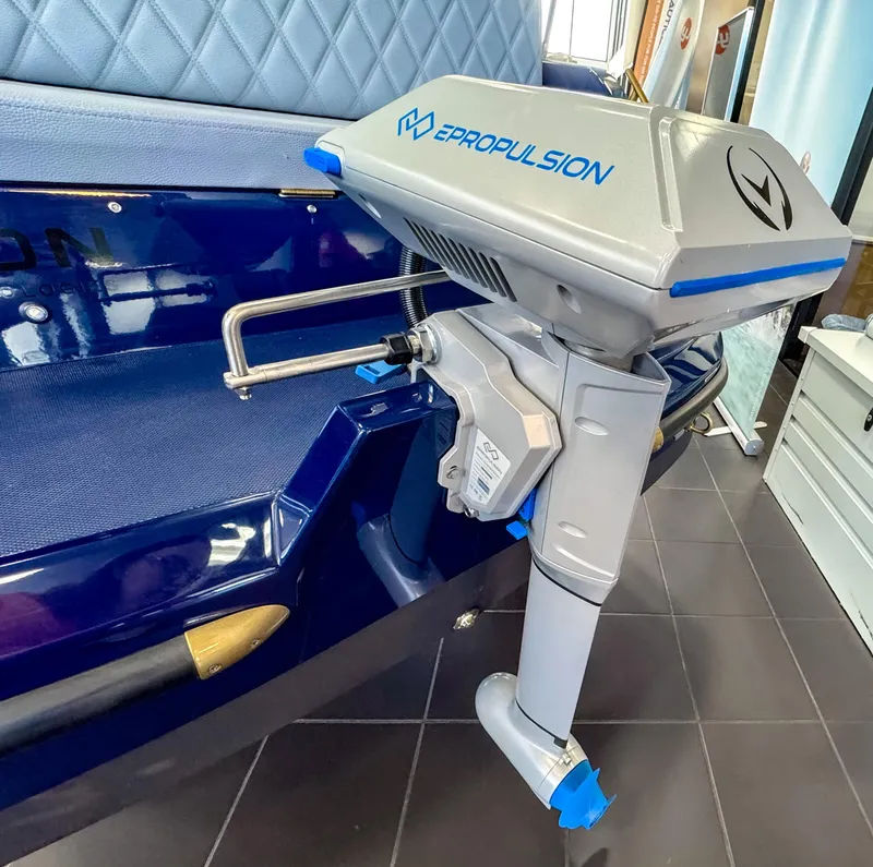 Slide: The Image of Electric outboard motor on Vision Marine Technologies Volt 180, 2025 model, in a showroom setting. - 10