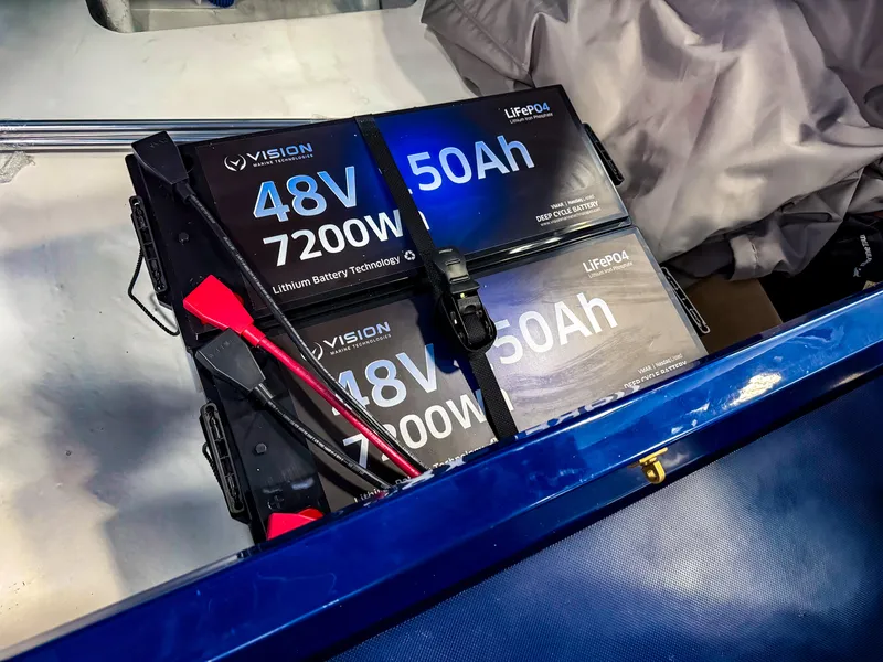 Slide: The Image of Lithium battery setup in Vision Marine Technologies Volt 180, 2025 model, featuring 48V 7200W capacity. - 15