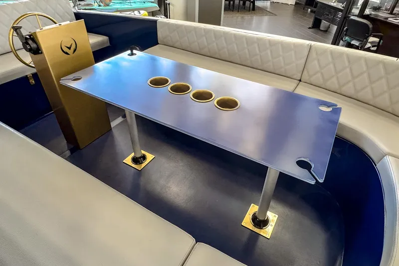 Slide: The Image of Interior of 2025 Vision Marine Technologies Volt 180 boat with seating and table. - 5