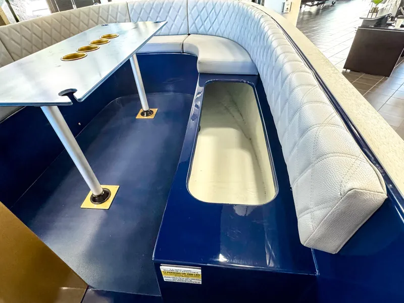 Slide: The Image of Interior of 2025 Vision Marine Technologies Volt 180 boat with seating and table. - 8