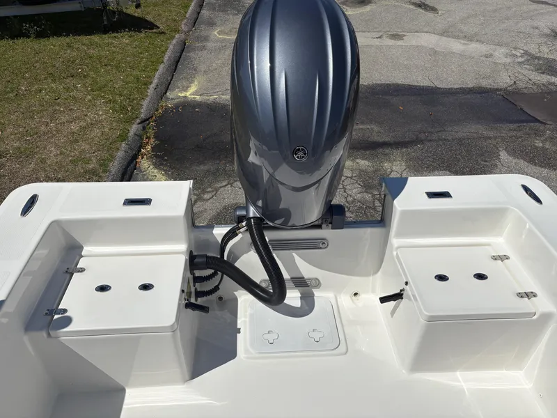 Slide: The Image of 2025 Bay Rider 2260 Skiff boat with outboard motor, rear deck view. - 9