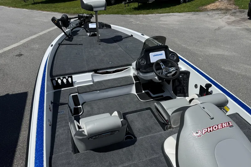 Slide: The Image of 2026 Phoenix ZXL 818 PRO fishing boat interior with steering console and seating. - 12