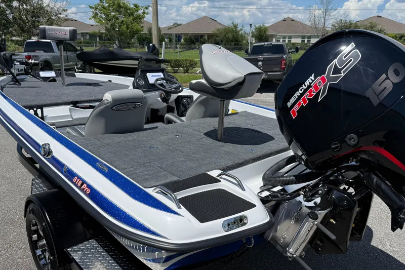 Slide: The Image of 2026 Phoenix ZXL 818 PRO boat with Mercury Pro XS engine, parked outdoors. - 6