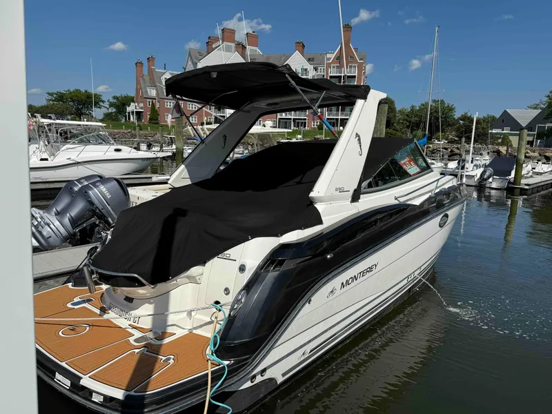 Slide: The Image of 2013 Monterey 280 SCR boat docked at marina with cover, for sale sign visible. - 13