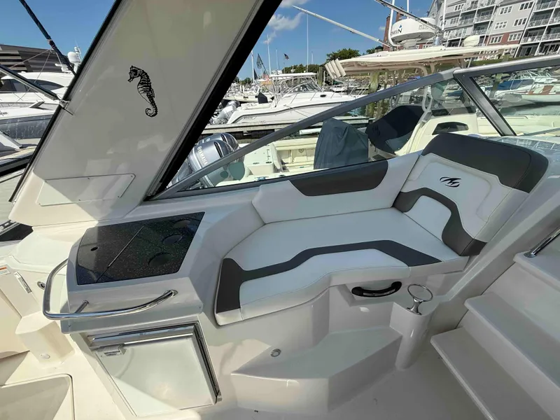 Slide: The Image of Luxurious seating area on a 2013 Monterey 280 SCR boat, featuring sleek design and modern amenities. - 5