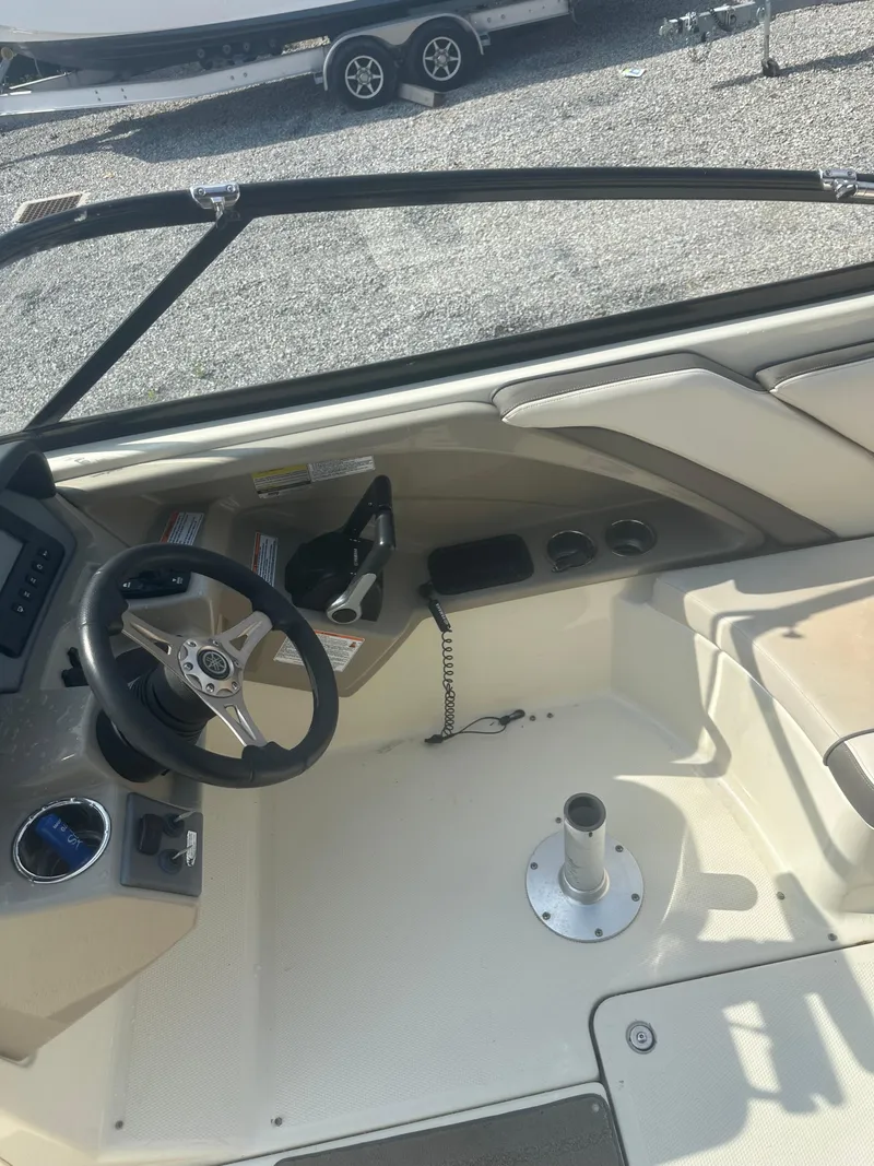 Slide: The Image of 2015 Yamaha Boats 242 Limited cockpit with steering wheel and controls. - 8