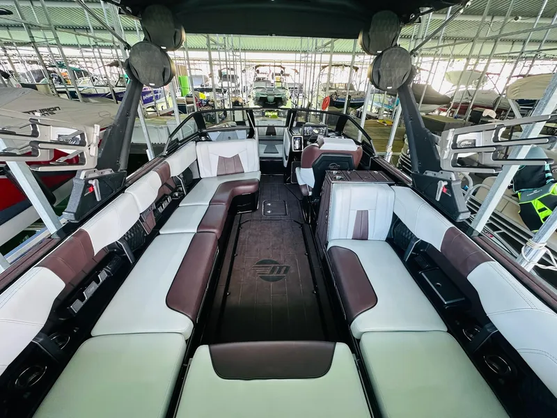 Slide: The Image of 2022 Malibu Wakesetter 24 MXZ interior with spacious seating and modern design. - 12