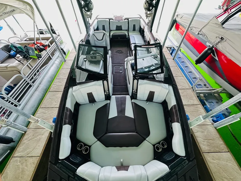 Slide: The Image of 2022 Malibu Wakesetter 24 MXZ interior with spacious seating and modern design. - 14