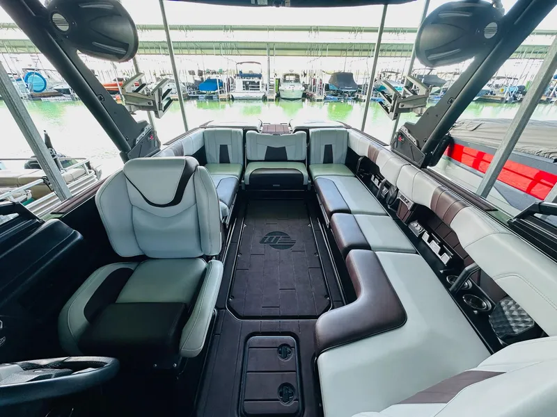 Slide: The Image of Interior of 2022 Malibu Wakesetter 24 MXZ boat with spacious seating and modern design. - 15
