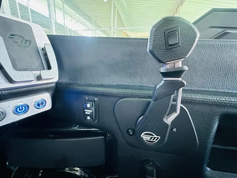 Slide: The Image of Interior controls of 2022 Malibu Wakesetter 24 MXZ boat, featuring sleek design and modern buttons. - 17