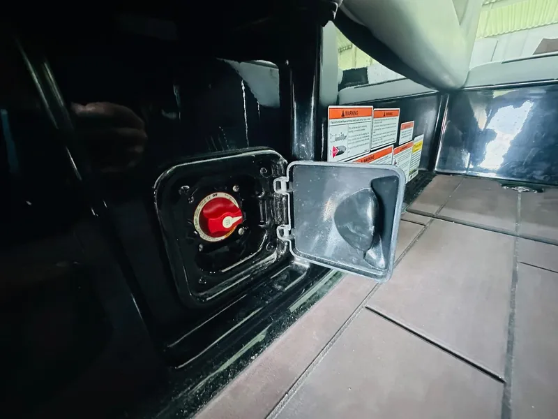 Slide: The Image of Battery switch compartment in 2022 Malibu Wakesetter 24 MXZ boat. - 19