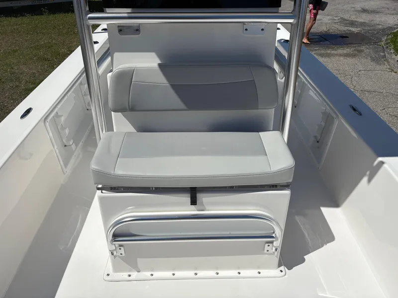 Slide: The Image of 2025 Bay Rider 2260 Skiff interior with cushioned seating and stainless steel railings. - 10