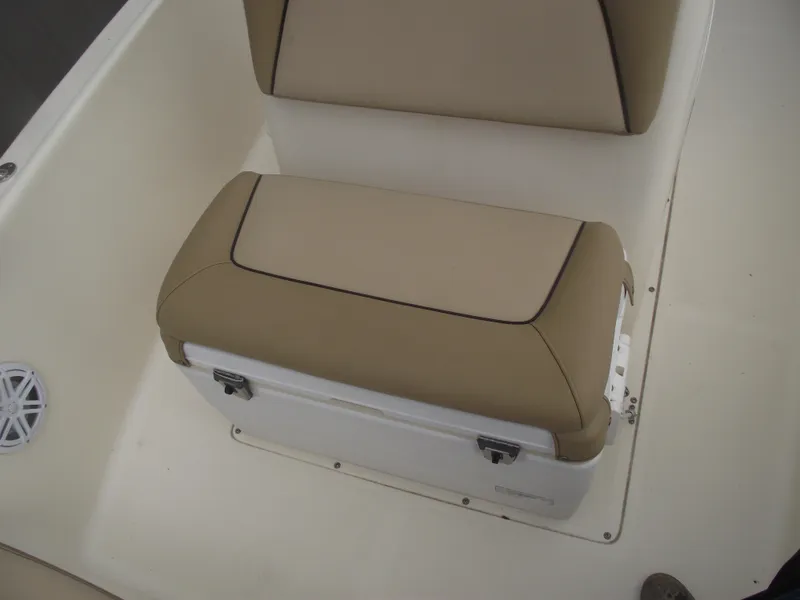 Slide: The Image of 2018 Scout 175 Sportfish boat seat with beige cushions and integrated storage. - 10