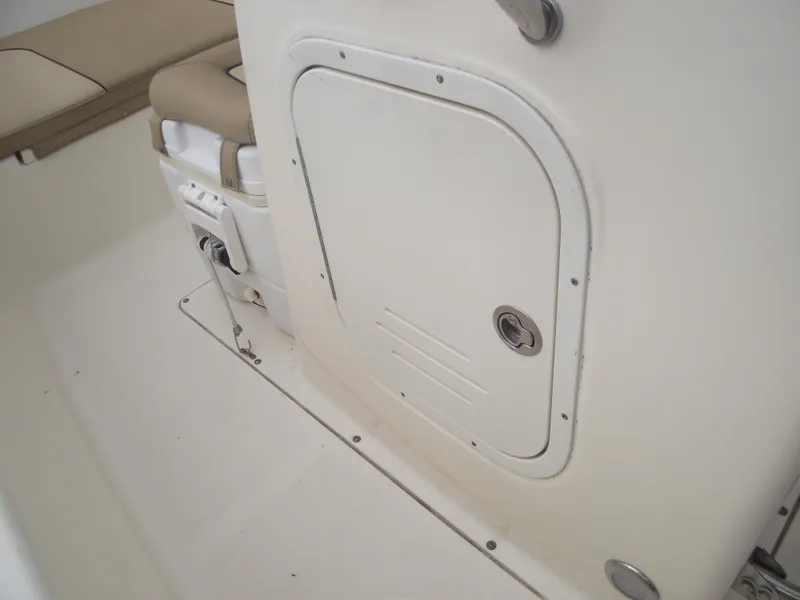 Slide: The Image of 2018 Scout 175 Sportfish boat interior with storage compartment and seating. - 13