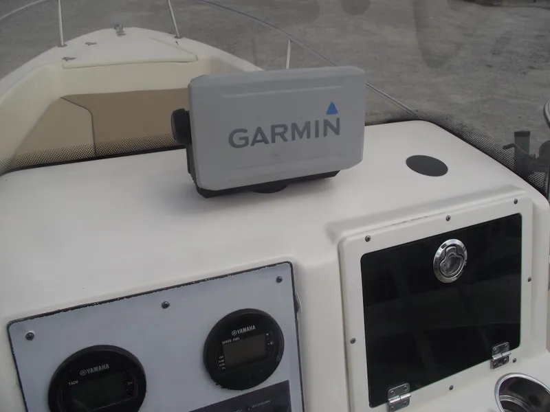 Slide: The Image of 2018 Scout 175 Sportfish dashboard with Garmin GPS and Yamaha gauges. - 19