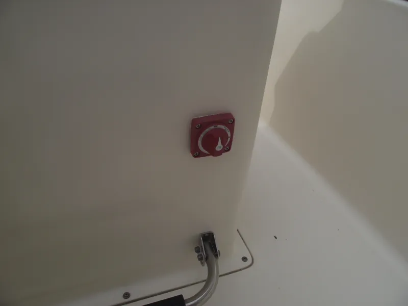 Slide: The Image of Red control switch on 2018 Scout 175 Sportfish boat interior. - 21