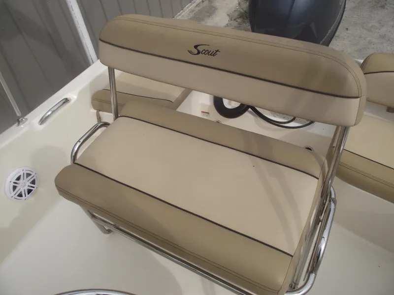 Slide: The Image of 2018 Scout 175 Sportfish boat seat with beige upholstery and stainless steel frame. - 23