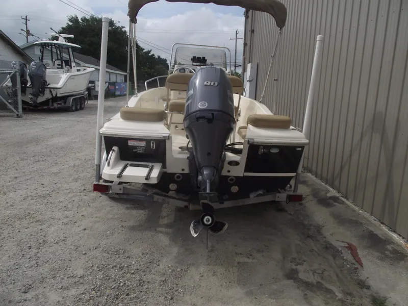 Slide: The Image of 2018 Scout 175 Sportfish boat with Yamaha 90 engine, parked outdoors. - 3