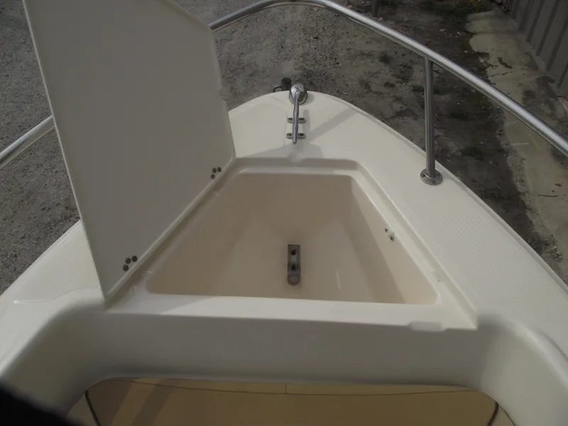 Slide: The Image of 2018 Scout 175 Sportfish boat with open storage compartment on deck. - 6