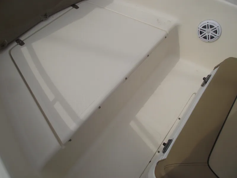 Slide: The Image of Interior of 2018 Scout 175 Sportfish boat, featuring seating and speaker. - 8