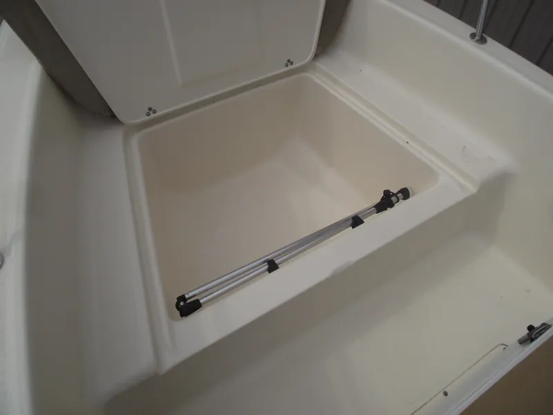 Slide: The Image of Open storage compartment in 2018 Scout 175 Sportfish boat. - 9