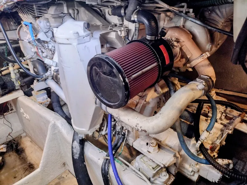 Slide: The Image of Engine compartment of 1999 Maxum 4600 SCB boat with visible air filter. - 16