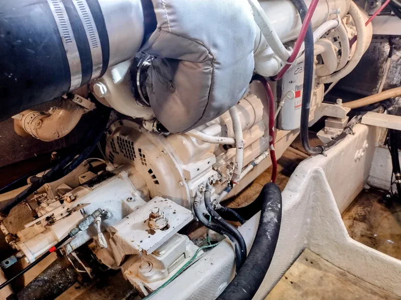 Slide: The Image of Engine room of 1999 Maxum 4600 SCB yacht, showcasing detailed mechanical components. - 17