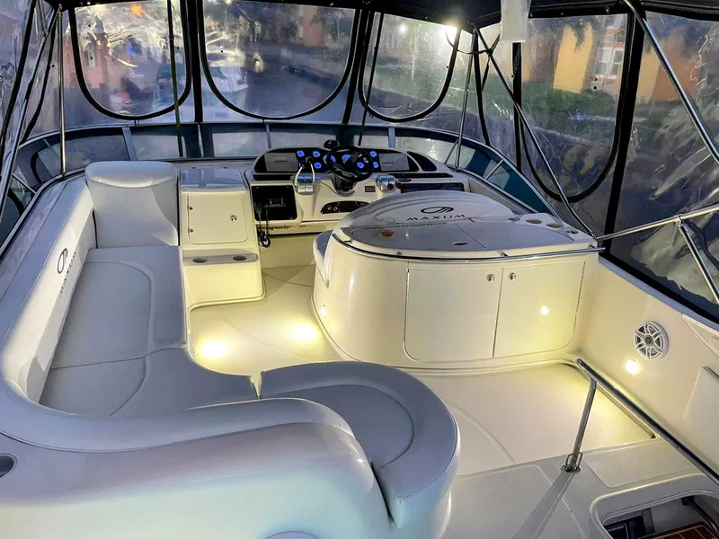 Slide: The Image of Luxurious interior of 1999 Maxum 4600 SCB yacht with elegant seating and modern controls. - 4