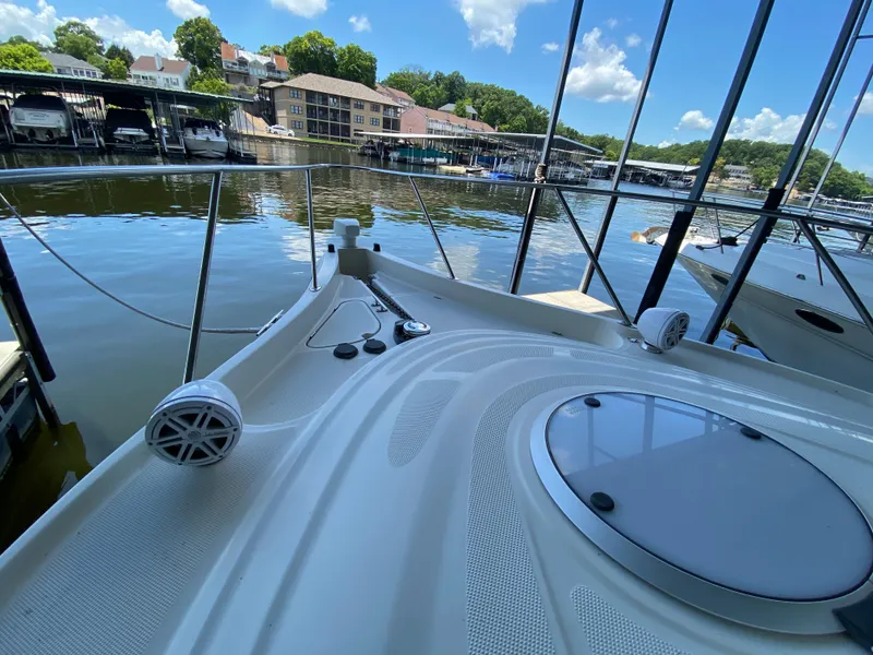 Slide: The Image of 1998 Maxum 3700 SCR yacht docked at marina, sunny day, clear sky, waterfront view. - 19