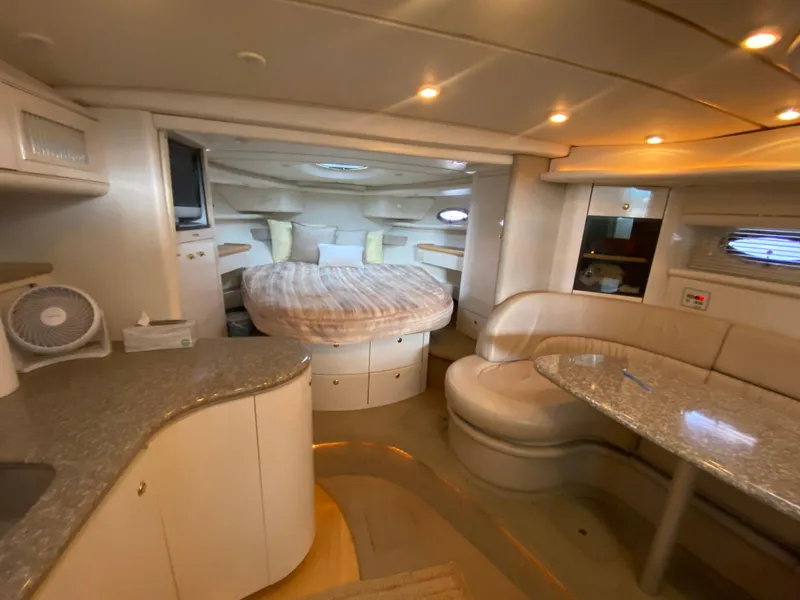 Slide: The Image of Luxurious interior of 1998 Maxum 3700 SCR yacht with cozy seating and elegant design. - 32