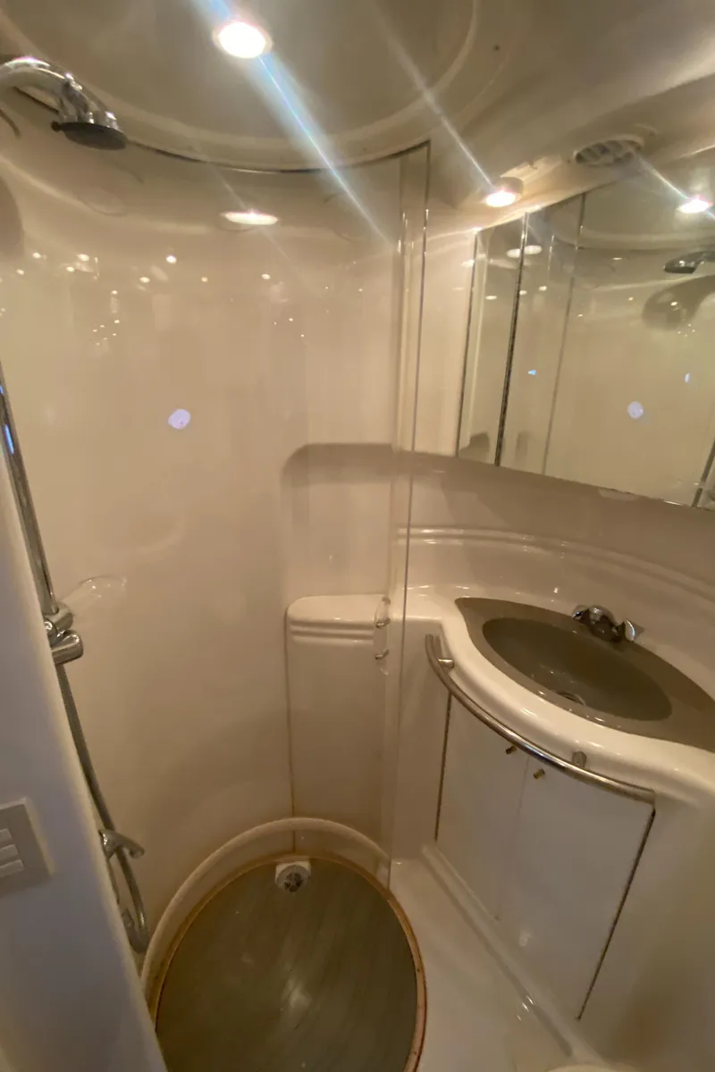 Slide: The Image of 1998 Maxum 3700 SCR yacht bathroom with shower, sink, and mirror. - 38