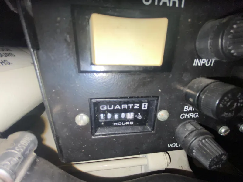 Slide: The Image of Control panel of a 1998 Maxum 3700 SCR boat showing 1060.1 hours on quartz hour meter. - 42
