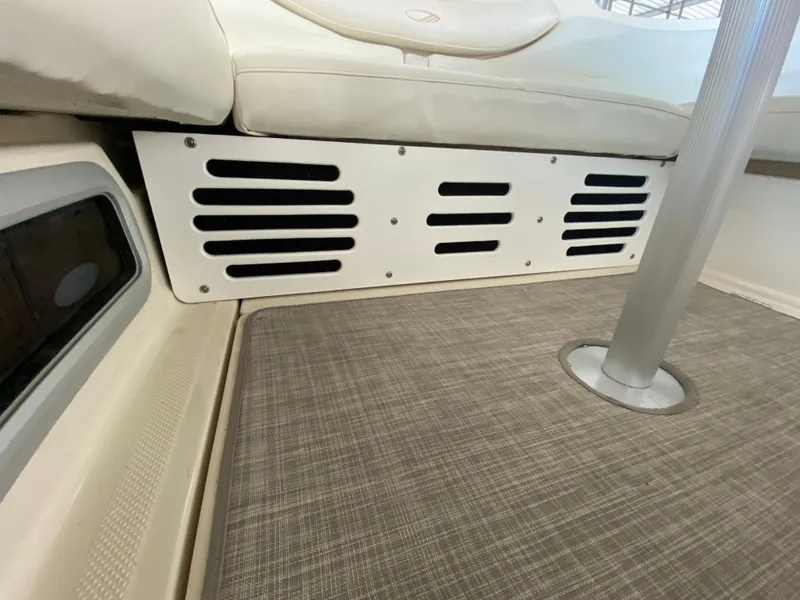 Slide: The Image of Interior of a 1998 Maxum 3700 SCR boat, featuring seating and vented panel. - 7