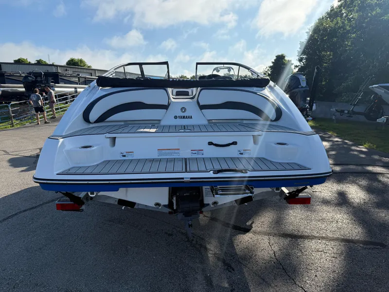 Slide: The Image of 2025 Yamaha SX195 boat rear view, showcasing sleek design and spacious deck. - 5