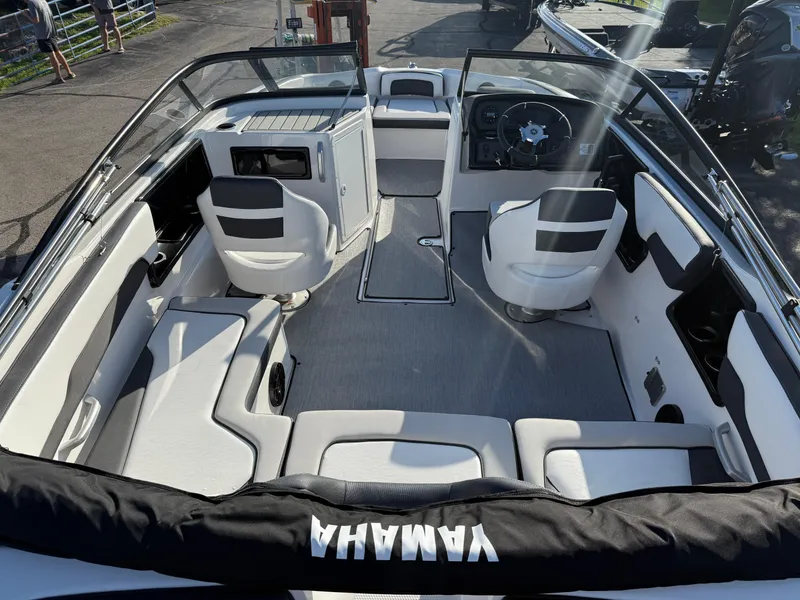Slide: The Image of 2025 Yamaha SX195 boat interior with modern seating and steering wheel. - 6