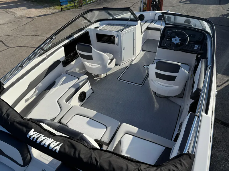 Slide: The Image of 2025 Yamaha Boats SX195 interior with sleek seating and modern dashboard design. - 7