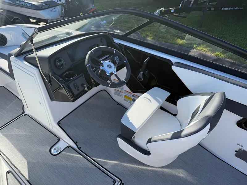 Slide: The Image of 2025 Yamaha Boats SX195 cockpit with steering wheel and seating, featuring modern design and controls. - 8