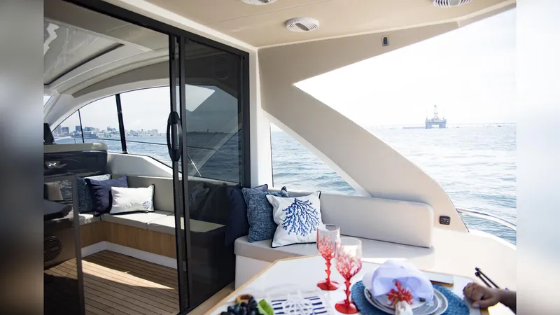Slide: The Image of Luxurious interior of 2025 NX Boats NX50 Invictus HT yacht with ocean view. - 11
