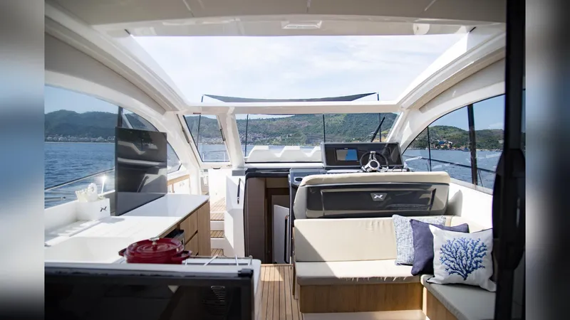 Slide: The Image of Luxurious interior of 2025 NX Boats NX50 Invictus HT yacht with modern amenities and scenic views. - 12