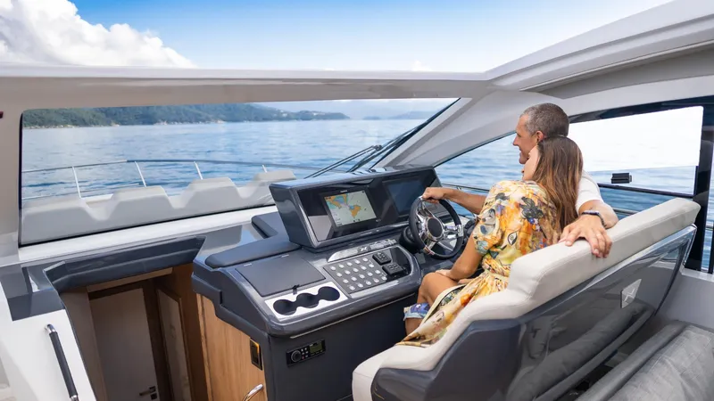 Slide: The Image of Couple enjoying a ride on the 2025 NX Boats NX50 Invictus HT yacht. - 22