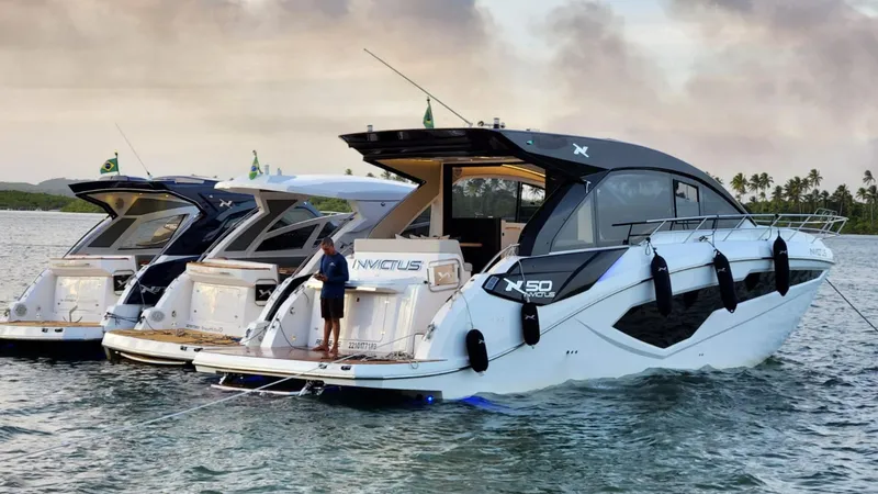 Slide: The Image of 2025 NX Boats NX50 Invictus HT yacht on water, sleek design, luxury vessel. - 9