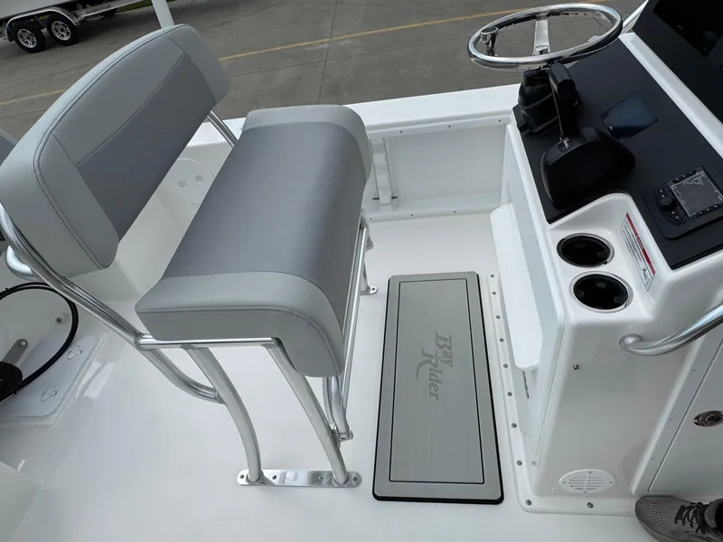 Slide: The Image of 2025 Bay Rider 2060 Skiff interior with helm, seating, and console details. - 13
