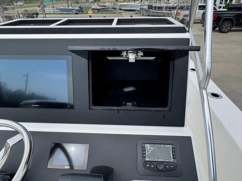Slide: The Image of 2025 Bay Rider 2060 Skiff dashboard with Garmin and Yamaha displays. - 17