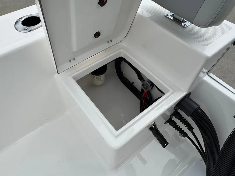 Slide: The Image of Open storage compartment on 2025 Bay Rider 2060 Skiff boat, showing wiring and components. - 20