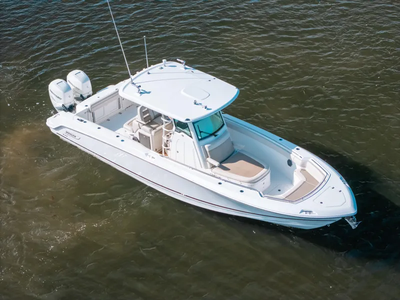 Slide: The Image of 2019 Boston Whaler 330 Outrage boat on water, aerial view. - 17
