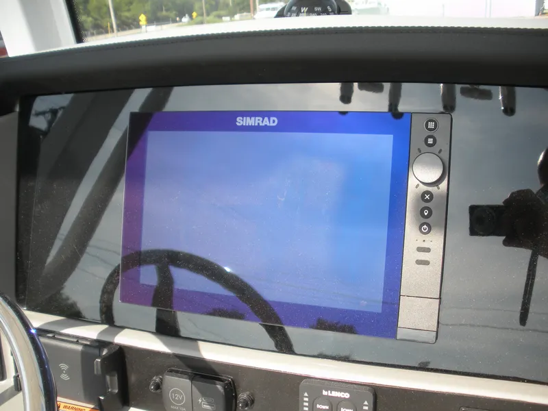 Slide: The Image of Simrad display on 2026 Robalo R246 Caymann boat dashboard. - 10