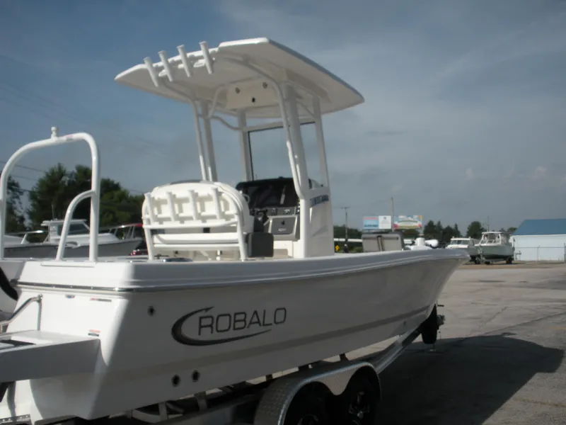 Slide: The Image of 2026 Robalo R246 Caymann boat on trailer, outdoor display. - 19