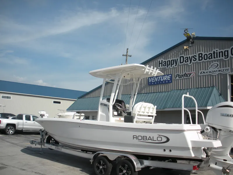 Slide: The Image of 2026 Robalo R246 Caymann boat at Happy Days Boating Co. dealership. - 20